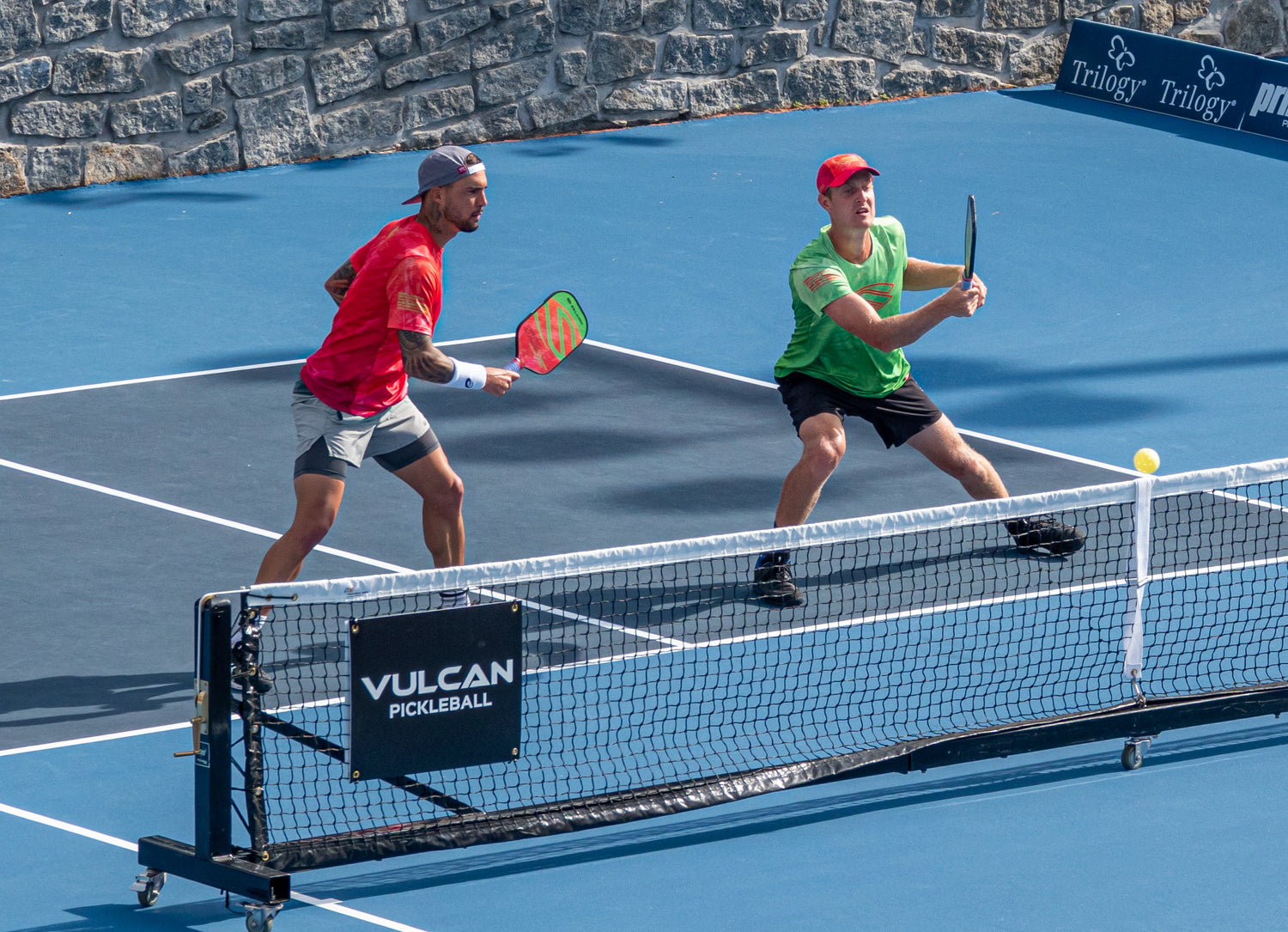 Tyson McGuffin playing doubles pickleball in a tournament.