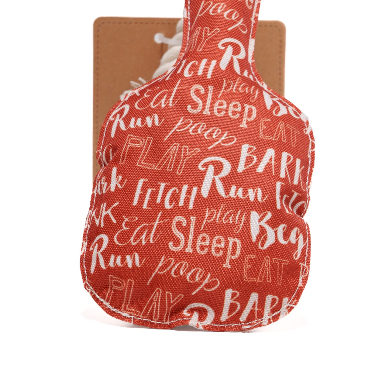 Detailed view of the back of a dog toy shaped like a pickleball paddle