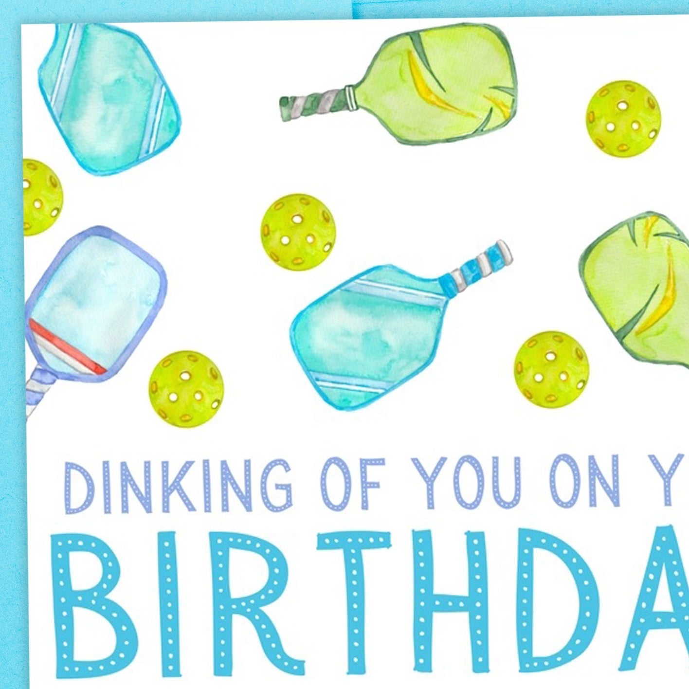 Close up image of a pickleball-themed birthday card that says "Dinking Of You On Your Birthday" Greeting Card