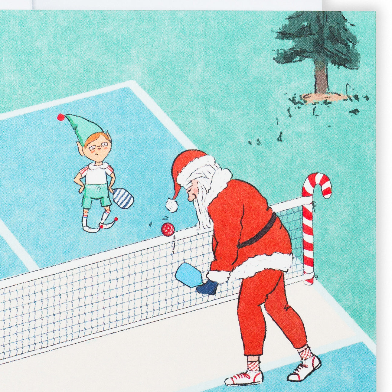 Close up of a pickleball Christmas greeting card showing Santa playing pickleball with elves.