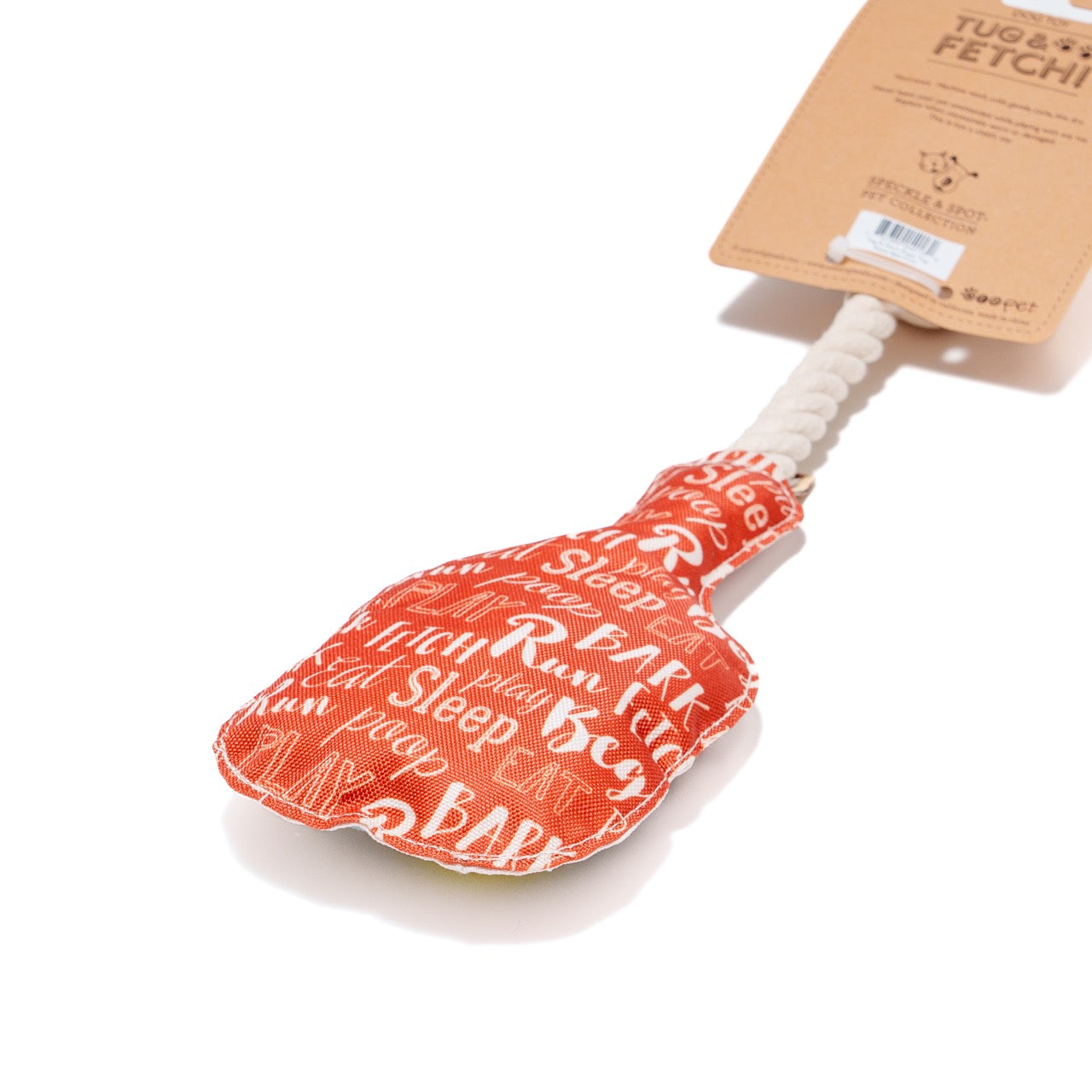 Packaging for the back of a dog toy shaped like a pickleball paddle