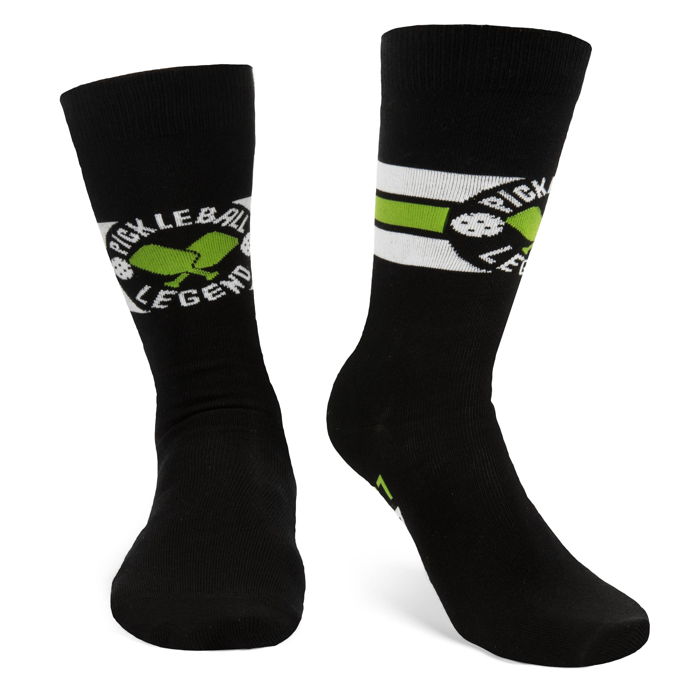 Model of a pair of black white and green pickleball themed crew socks on a white studio back drop