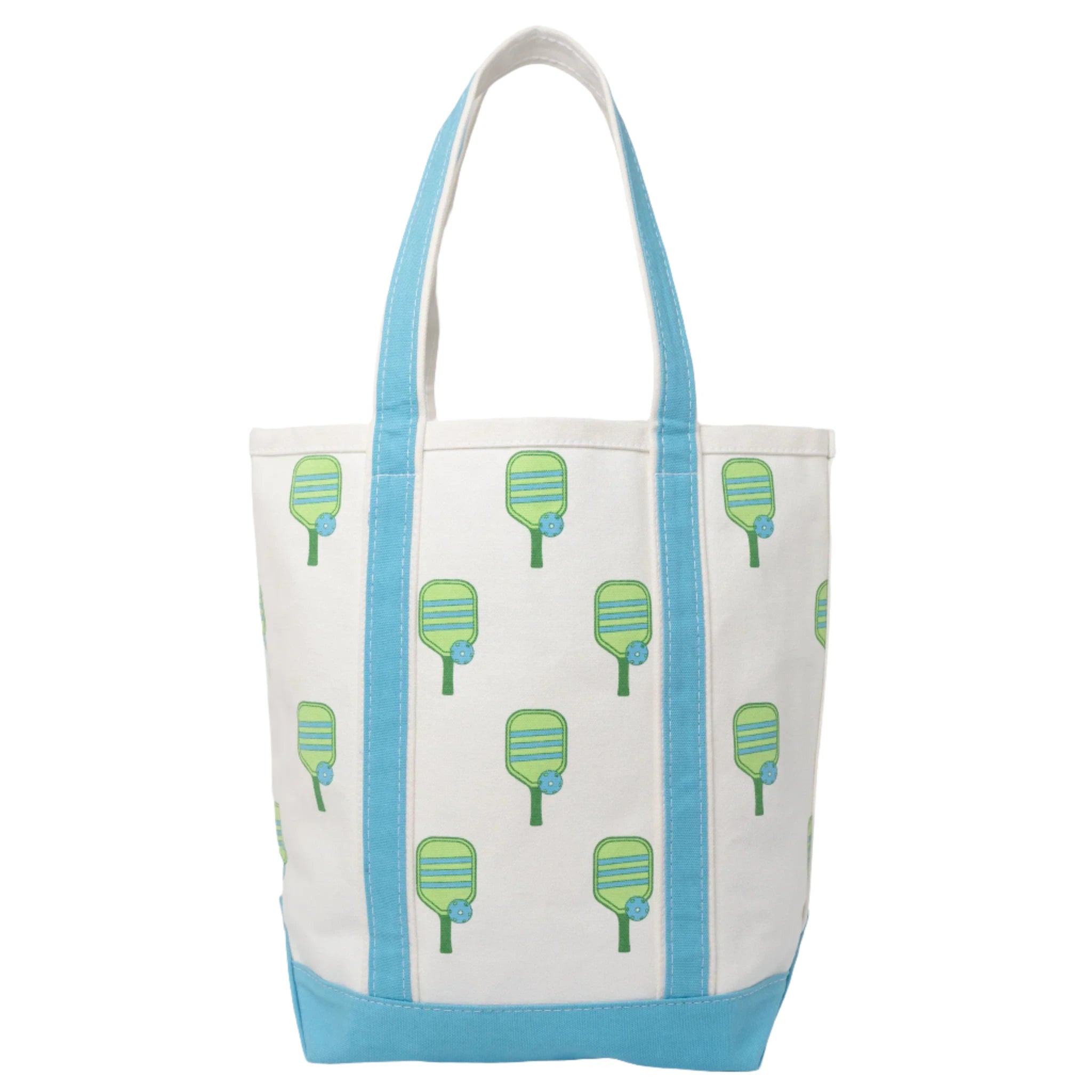 White canvas beach tote with blue handles and pickleball paddles on a studio backdrop
