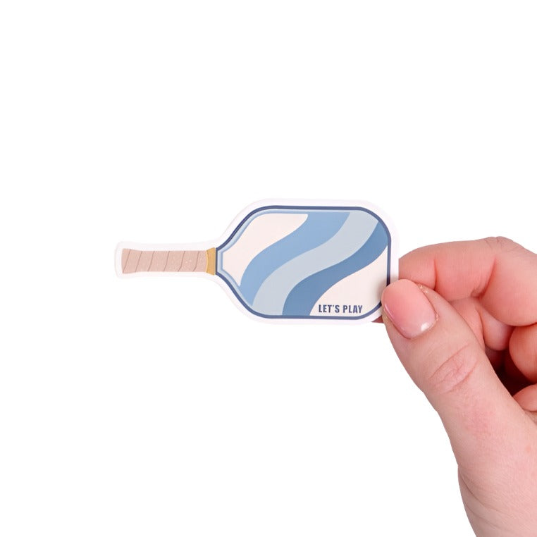Blue sticker shaped like a pickleball paddle with "LET&