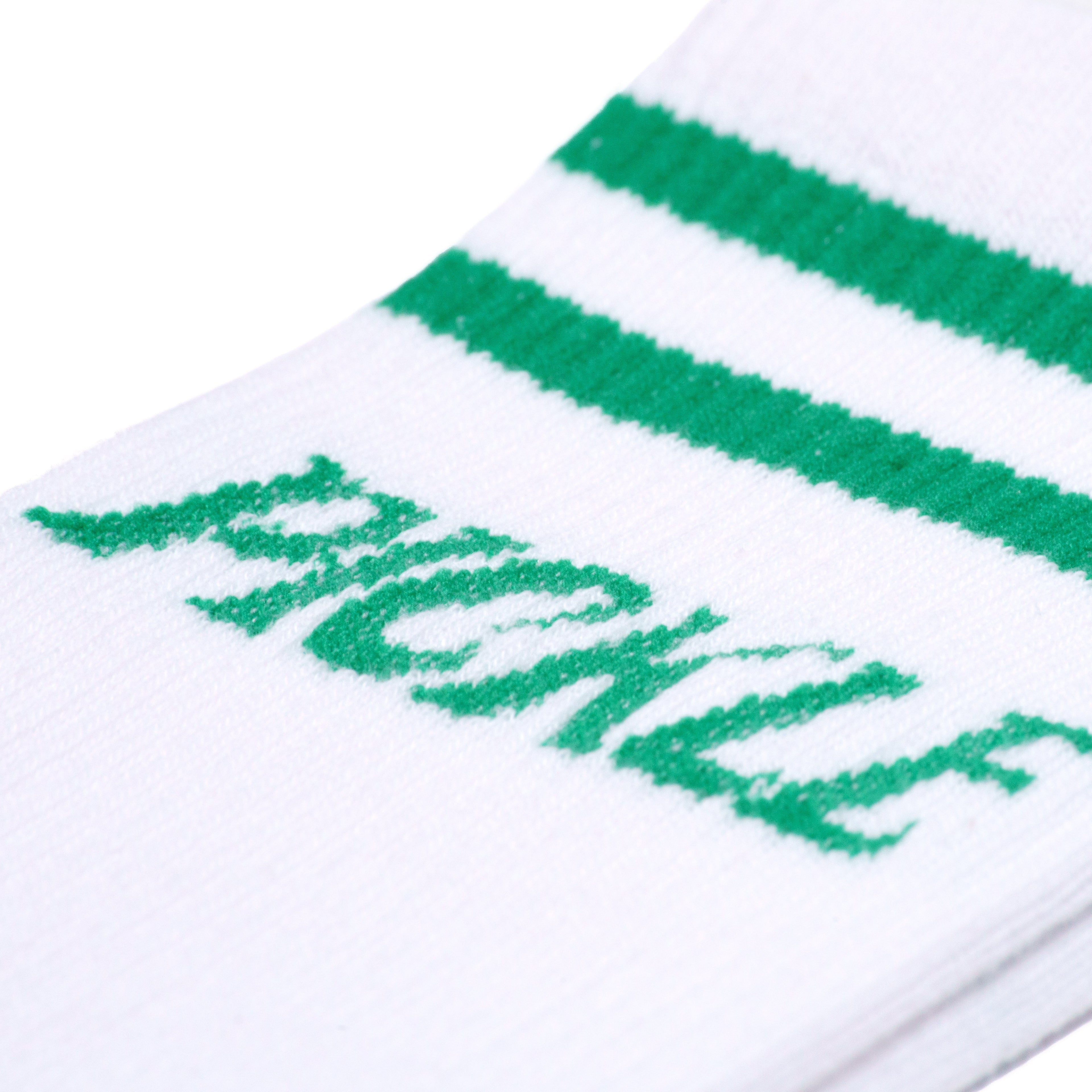 Detailed view of white retro mid calf pickleball socks with green stripes and green text that says "Pickle".