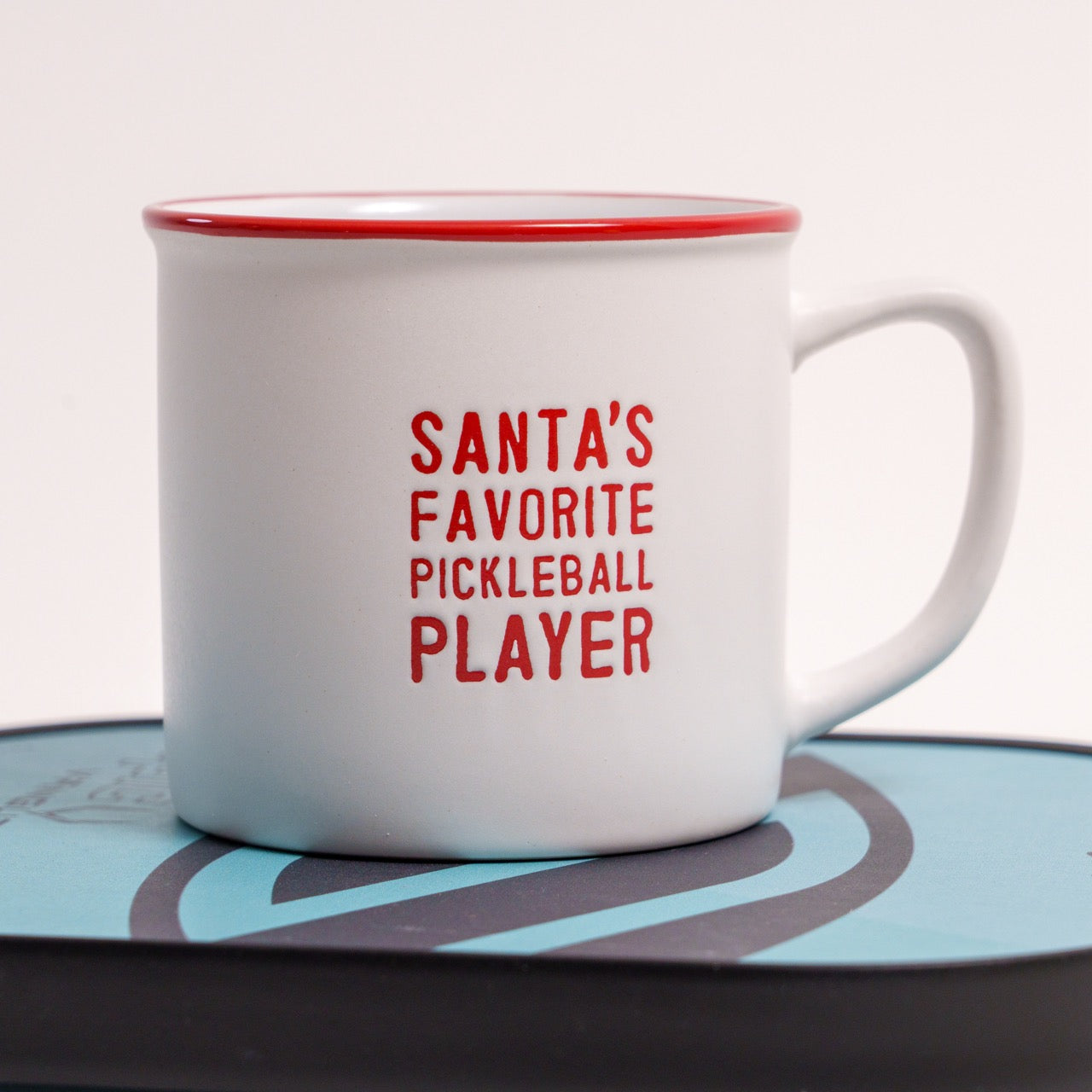Ceramic coffee mug that says Santa&