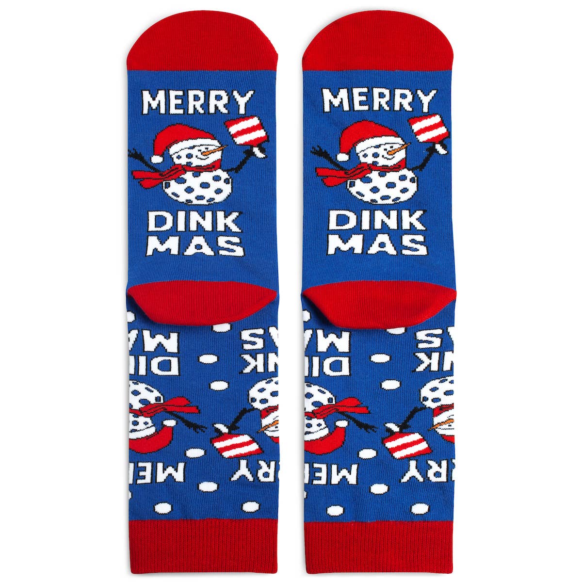 Pair of Christmas pickleball themed crew socks with snowmen that says Merry Dinkmas laying flat on a white surface with the bottoms facing upwards