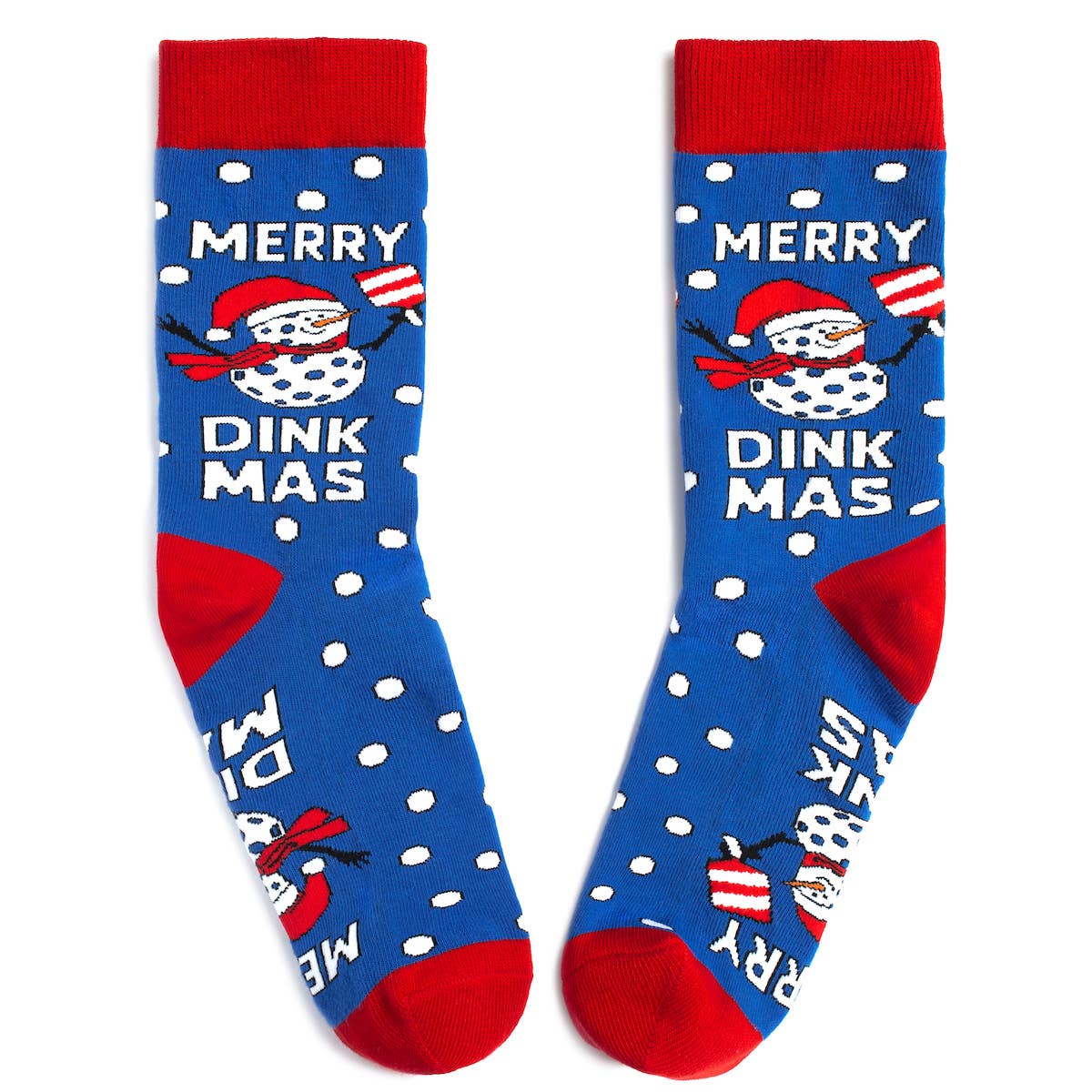 Pair of Christmas pickleball themed crew socks with snowmen that says Merry Dinkmas laying flat on a white surface