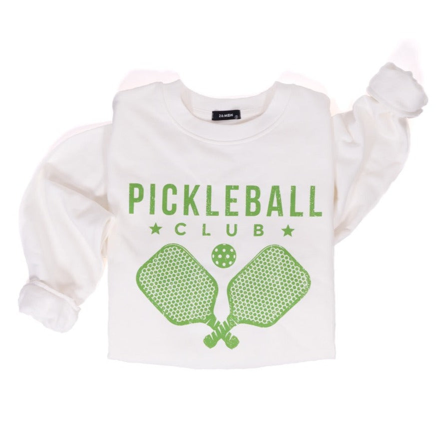 White crew neck sweatshirt with green text that says "Pickleball Club" and a green image of pickleball paddles and a pickleball on it