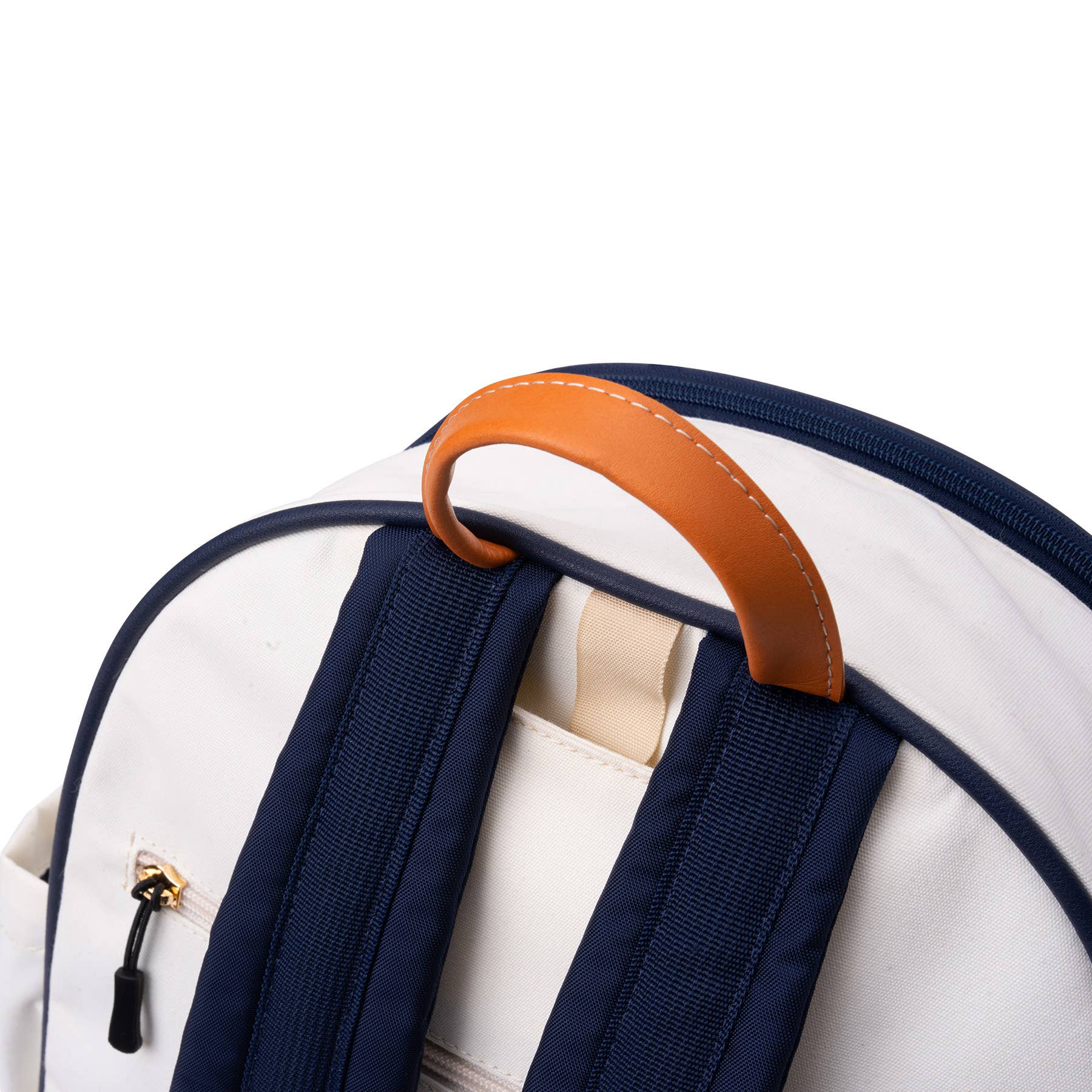Close up of leather handle of white pickleball paddle backpack with navy blue straps