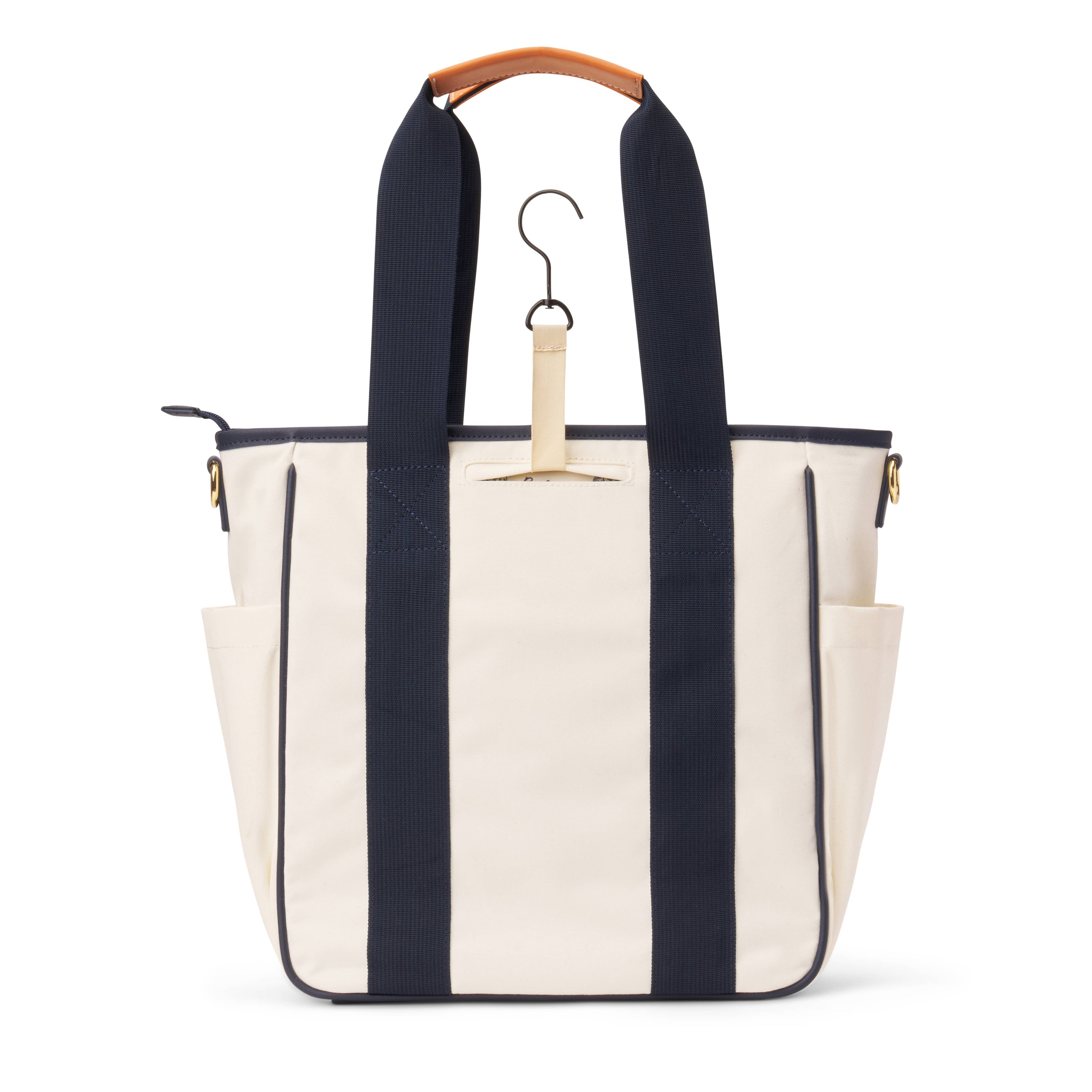 Back of white pickleball paddle tote bag with navy blue handles with a built in bag hook showing