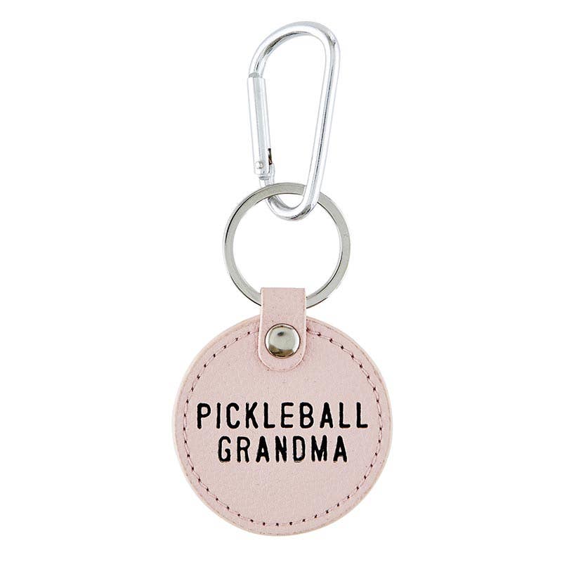 Round pink keychain that says "PICKLEBALL GRANDMA" on it