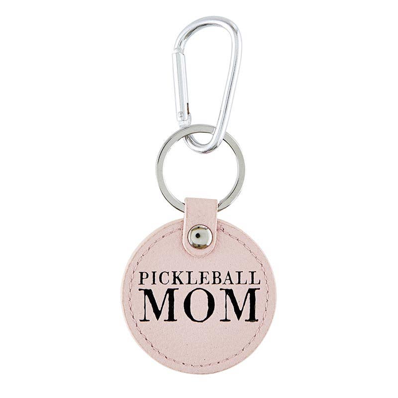 Round pink keychain that says "PICKLEBALL MOM" on it