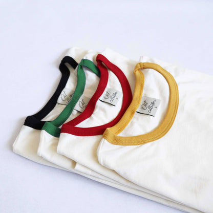 Four t-shirts each of a different color of the pickleball ringer t-shirt