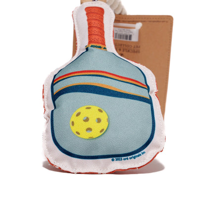 Detailed view of dog toy shaped like a pickleball paddle