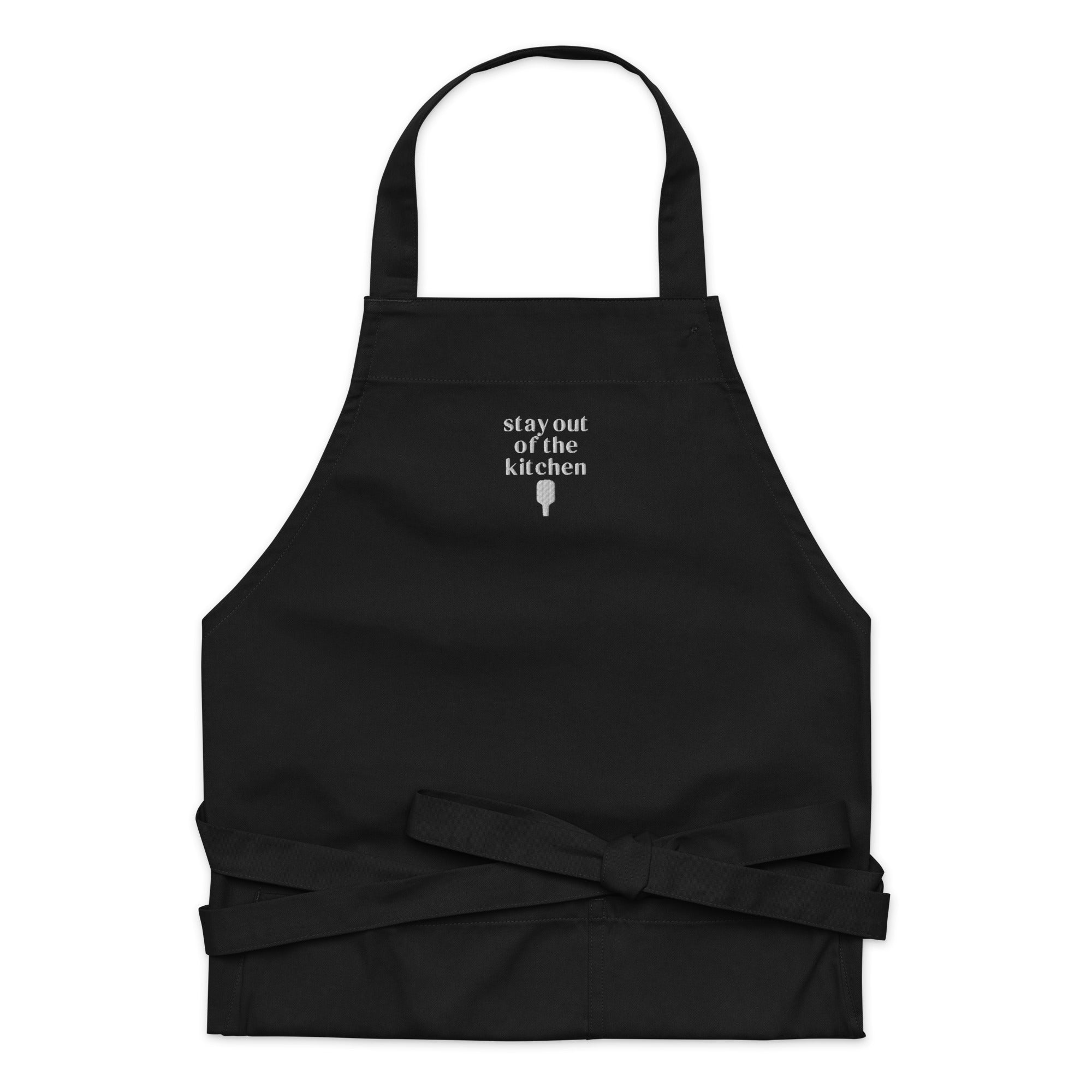 Embroidered black apron that says &quot;stay out of the kitchen&quot; and has a pickleball paddle on it