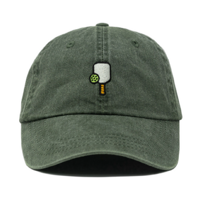 Washed green baseball hat with an embroidered pickleball paddle and ball on it
