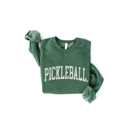 Zoomed out folded green crewneck sweatshirt that says &quot;Pickleball&quot; in white font on it