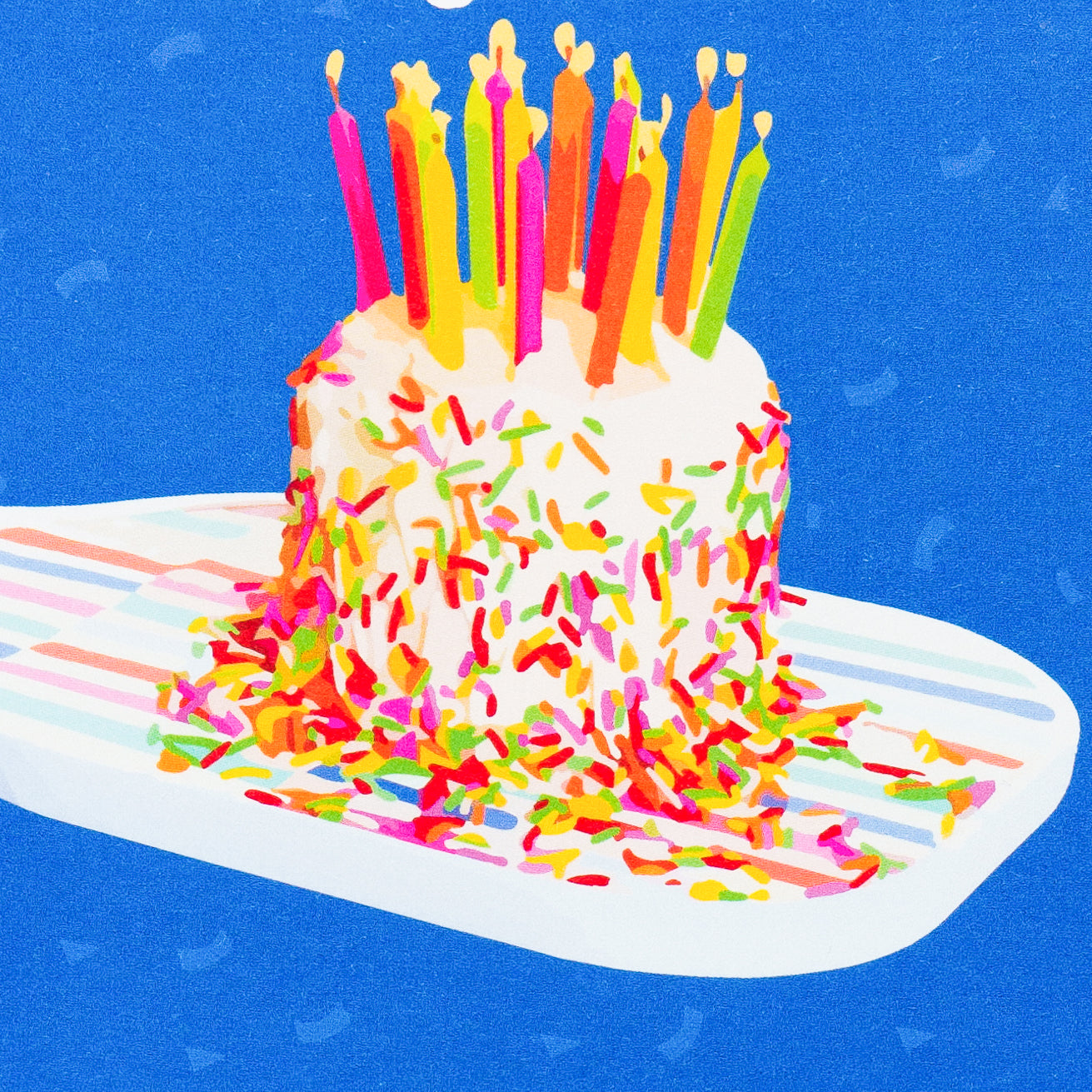 Close up of a colorful pickleball themed birthday card with a birthday cake with candles sitting on a pickleball paddle and big bold text that reads Happy Birthday laying flat on a white background.