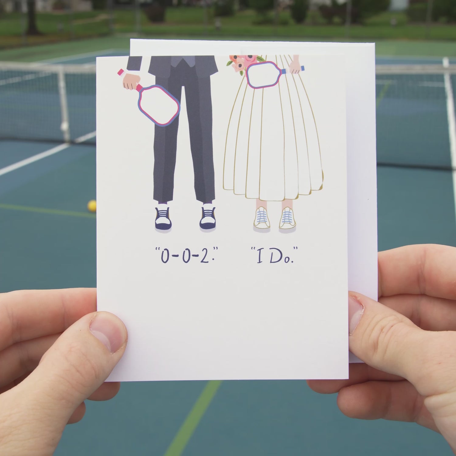 Video of an elegant pickleball themed wedding card with a bride and groom holding pickleball paddles and wearing sneakers