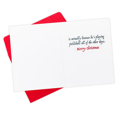 Inside message of a pickleball themed Christmas greeting card showing Santas home with a message that says &quot;The reason Santa only comes once a year... is actually because he&