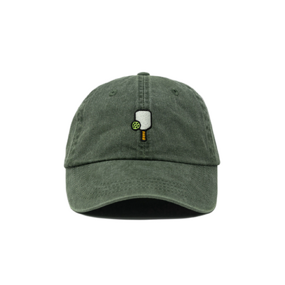 Washed green baseball hat with a pickleball paddle and ball embroidered on the front