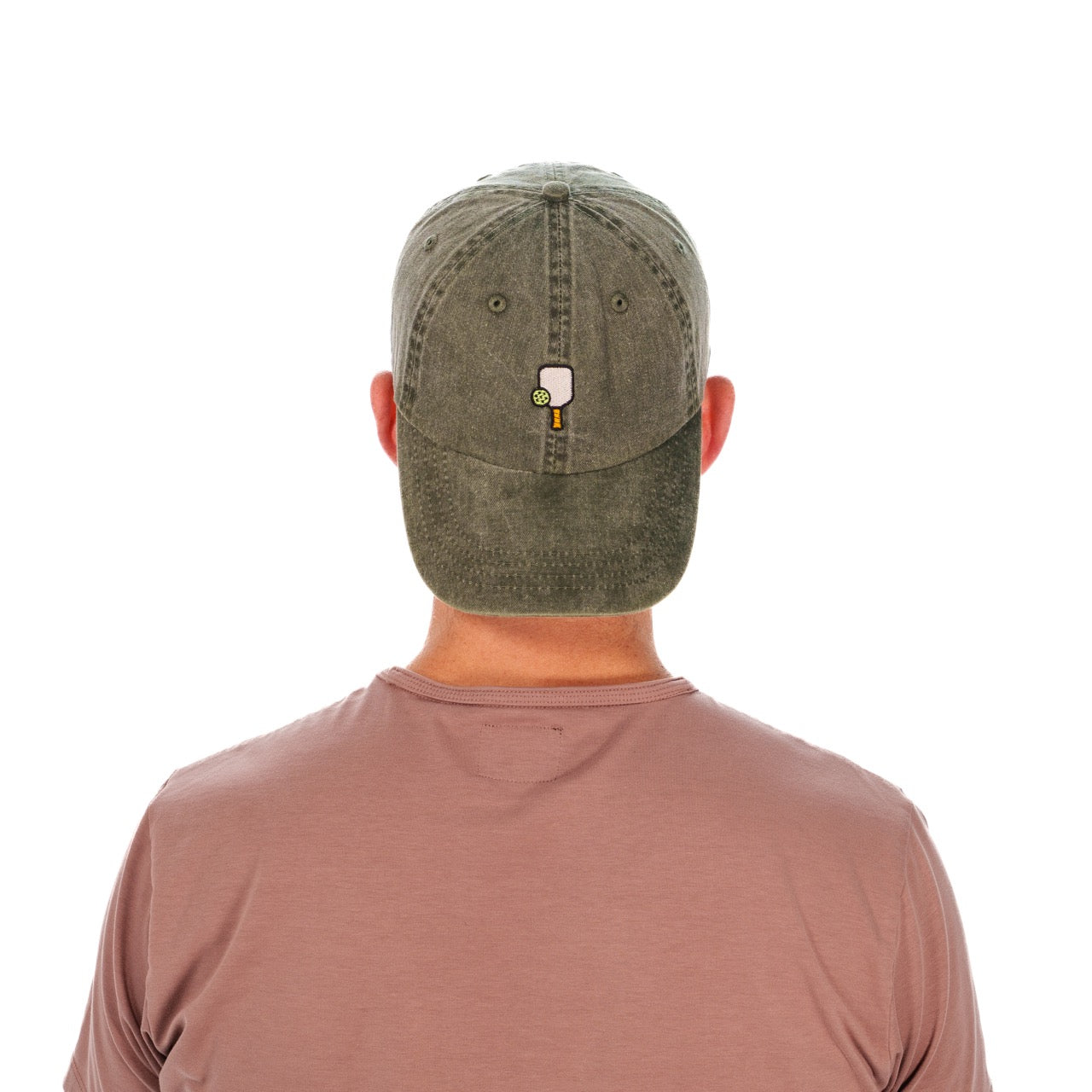 Man wearing a baseball hat backwards with a pickleball paddle and ball embroidered on it