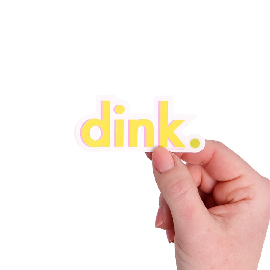 Yellow that says "dink" on it with a pickleball being held