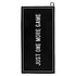 Black microfiber pickleball sport towel that says "JUST ONE MORE GAME" on it